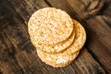 Salty rice crackers galettes with spices. Tasty salty healthy biscuits.