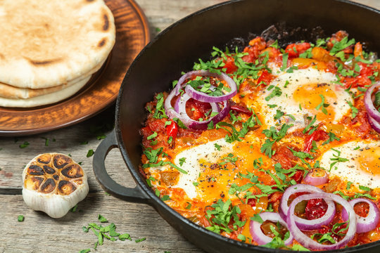 Traditional middle Eastern dish Shakshuka in a pan. 