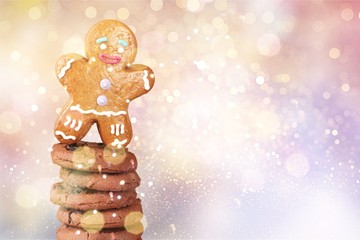 Tasty Cookies with chocolate and Gingerbread Man on background