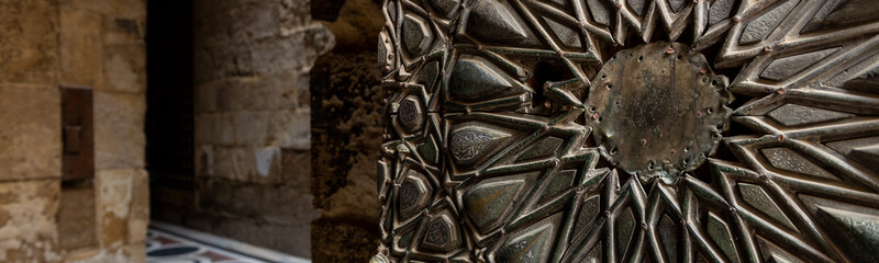 Amazing arabic decorations on the entrace doors of the Qalawun complex (Arabic: مجمع قلاون‎), a massive complex in islamic Cairo, Egypt