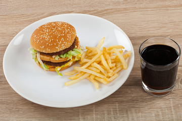 Delicious junk food: burger, fries, coke