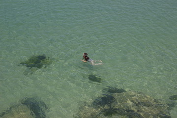 man snorkeling in the sea