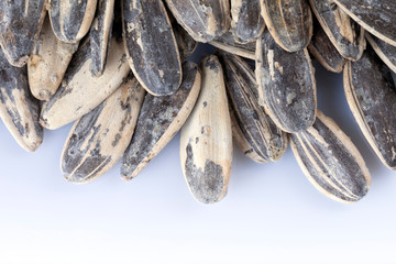 Many sunflower seeds toasted with salt isolated