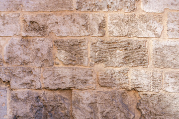 Ancient, medieval  brick  and stone wall. Mediterranean style. Spanish and Roman design. Aged wall.