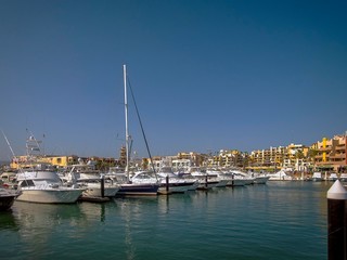 Fototapeta na wymiar Various boats and yachts moored at the marina in Los Cabos, Baja California, Mexico