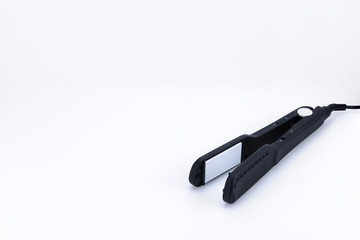 Grey hair iron on the white background with copy space.