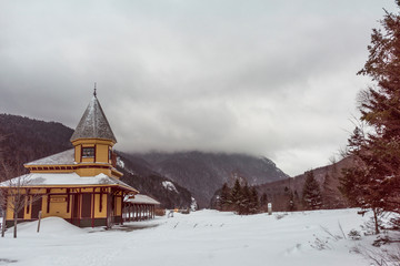 snow filled look at an abadoned railroad station