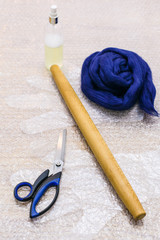 wool and set of tools to make felt on mat