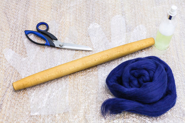 set of materials and tools to make felt on mat
