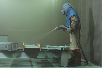Sandblast. Blasting metal.