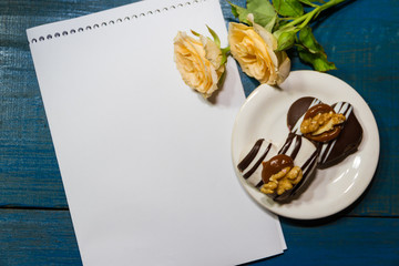 romantic coffee background with sweet cookies and roses with salutations