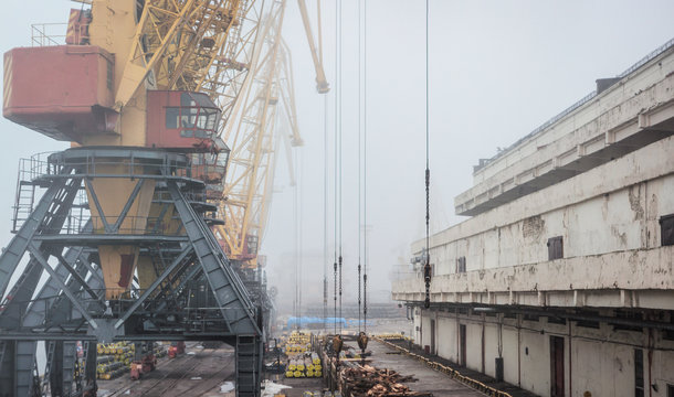 Port warehouse with ramp and cranes and other infrastructure of the port. Cargo port Odessa, Ukraine
