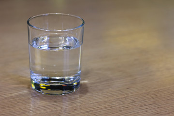 Glass of clear water on wooden table. . Healthy food - healthy lifestyle