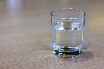 Glass of clear water on wooden table. . Healthy food - healthy lifestyle