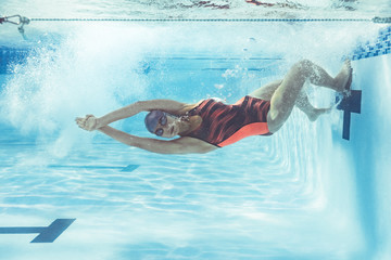 Swimmer in action inside swimming pool