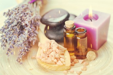 Obraz na płótnie Canvas Pile of lavender flowers and a dropper bottle with lavender