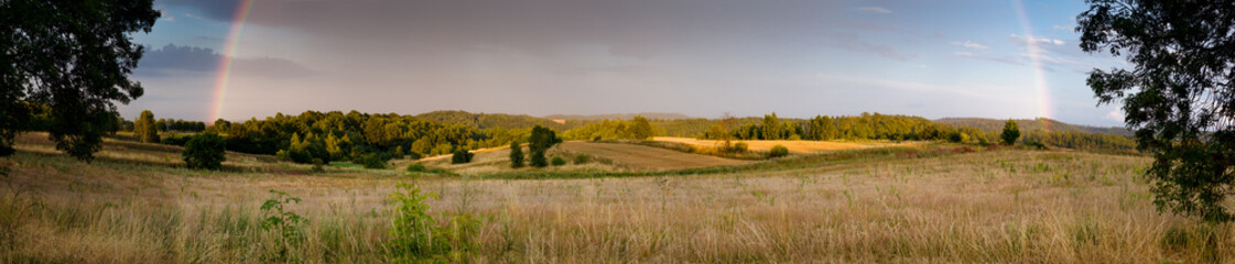 Rainbow on sunset panorama