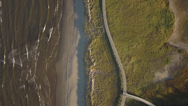 Aerial view of a beautiful sandy beach on the Atlantic Ocean Coast. Taken in La Dune de Bouctouche, New Brunswick, Canada.