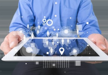 Male hands holding a tablet PC on background