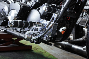 Obraz premium Cropped close up shot of beautiful and custom made motorcycle in the workshop