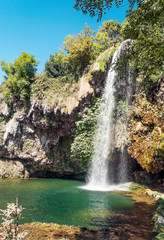Waterfall in a lake in the south of France on a sunny day