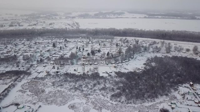 Beautiful winter landscape. Siberian village in the cold. Sunrise. Industrial landscape.