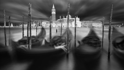 Italy beautiful afternoon with anchored gondolas and San Giorgio Maggiore island, Venice, Venezia