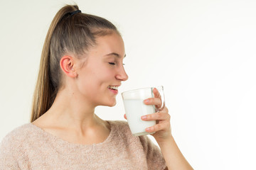 girl drinks milk and is happy