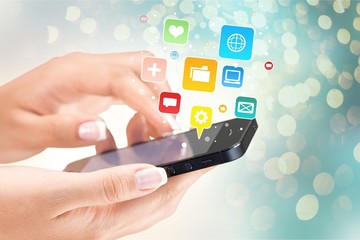 Hands holding smartphone  on background