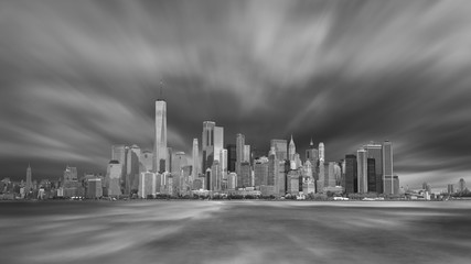 New York City Manhattan downtown skyline in evening with stormy sky
