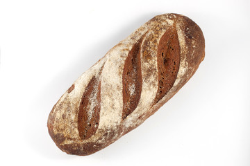 Fresh bread on white background. Beautifully sprinkled with flour.