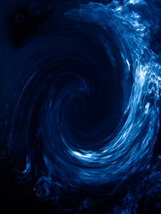 Abstracto; ola azul, celeste y blanco sobre fondo negro.