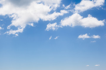 Fantastic view of the azure sky on a sunny day with fluffy clouds.