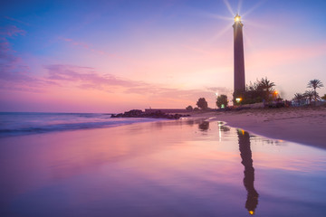 Lighthouse on the coast at sunset
