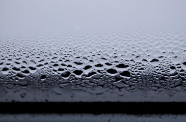 water drops caused by the melting of the ice on a winter window
