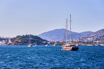 Fototapeta na wymiar Yacht on the sea, beautiful bay in Turkey, Bodrum. Aegean coast