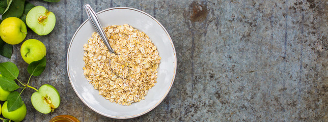 oatmeal with fruit - a mixture of cereal in a plate on the table. copy space. top