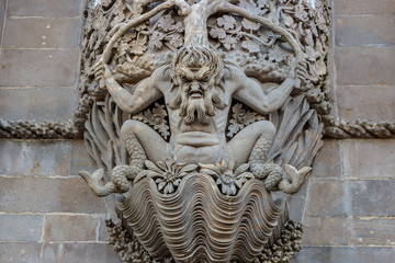 Triton over the lancet arch, Pena National Palace, Romanticist palace in Sintra