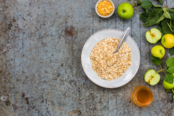 oatmeal with fruit - a mixture of cereal in a plate on the table. copy space. top