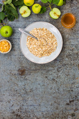 oatmeal with fruit - a mixture of cereal in a plate on the table. copy space. top