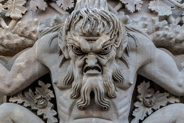 Triton over the lancet arch, Pena National Palace, Romanticist palace in Sintra