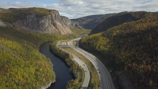 Aerial view of a scenic road during a vibrant sunny day. Taken near Corner Brook, Newfoundland, Canada.