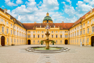 The main courtyard of historic Melk Abbey and blue sky in summer, Austria