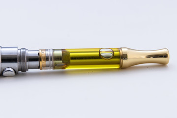 THC/CBD Cannabis Oil & Terpenes Filled Cartridges Up Close White Background
