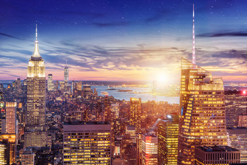 a magnificent aerial panoramic view of Manhattan with sunset