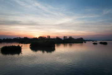 Fototapeta na wymiar Sunset over the Mekong river in Don Det island, Laos