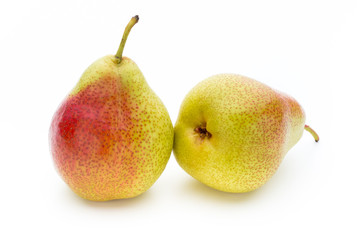 Fresh bio pear with leaves on isolated white background.