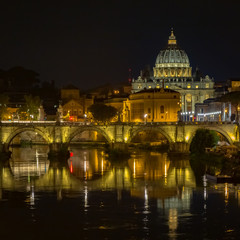Fototapeta premium Vatican City: Saint Peter with bridge reflection by night