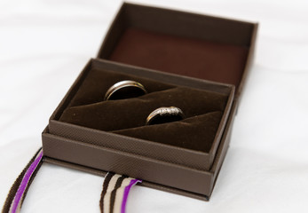 Wedding rings in a black ring box, soft with a beautiful creamy shallow depth of field. Wedding rings.
