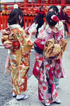Women in kimono standing outdoors